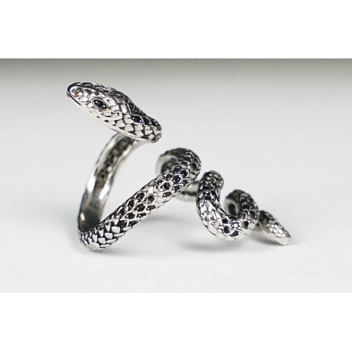 276 - A ladies silver dress ring in the the form of a snake, marked 925 to the inner shank.