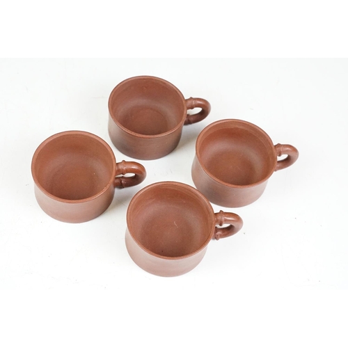 47 - Chinese terracotta Yixing tea ware to include a teapot with four small matching tea cups, teapot wit... 