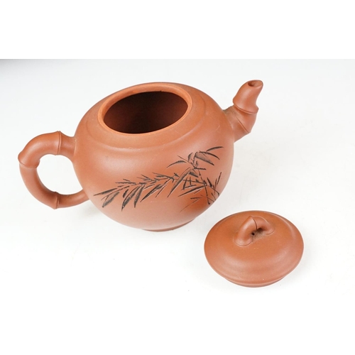 47 - Chinese terracotta Yixing tea ware to include a teapot with four small matching tea cups, teapot wit... 