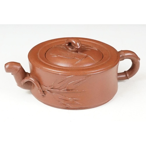 47 - Chinese terracotta Yixing tea ware to include a teapot with four small matching tea cups, teapot wit... 