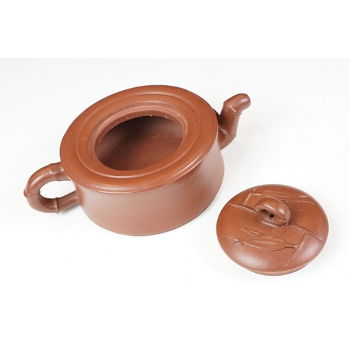 47 - Chinese terracotta Yixing tea ware to include a teapot with four small matching tea cups, teapot wit... 