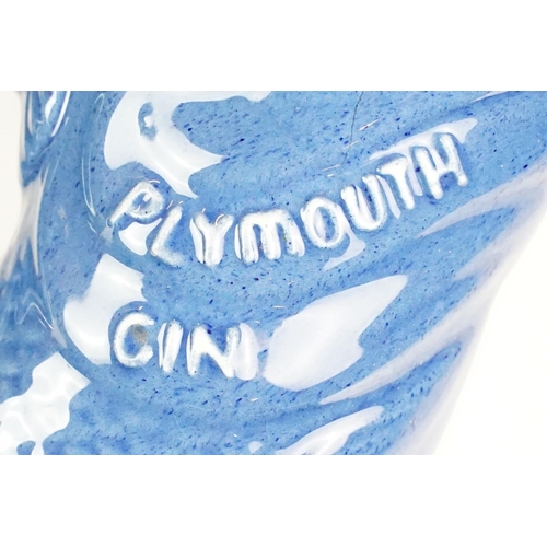 52 - Dartmouth 'Plymouth Gin' gurgle jug (approx 23.5cm tall), together with three green glass fishing fl... 