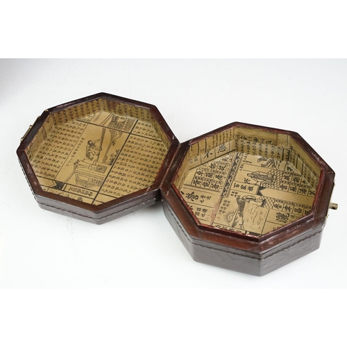 131 - Chinese octagonal wooden box with coin decoration to lid, together with a two-tiered woven lidded ca... 