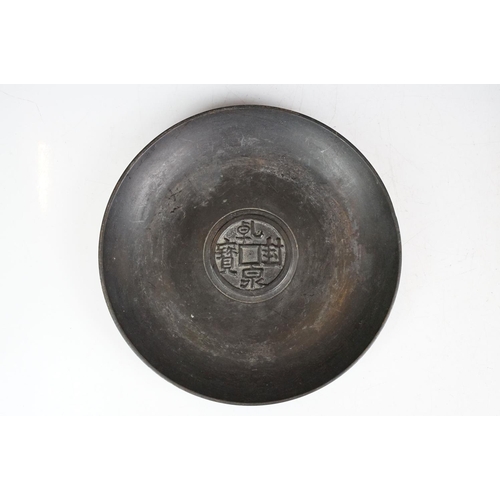 133 - Chinese bronze tazza / footed dish with coin decoration to centre, together with a matching circular... 