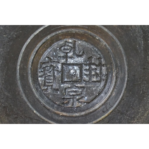 133 - Chinese bronze tazza / footed dish with coin decoration to centre, together with a matching circular... 