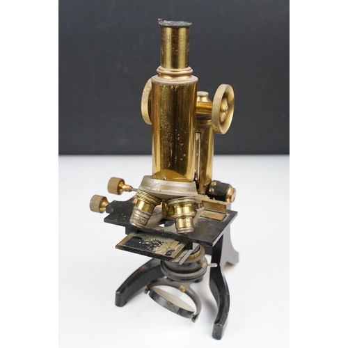 134 - J. Swift & Son of London brass lacquered microscope, housed within a wooden carry case (missing fron... 