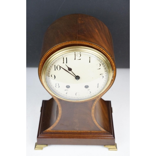 135 - Early 20th century inlaid mahogany balloon form mantel clock, raised on four gilt metal bracket feet... 