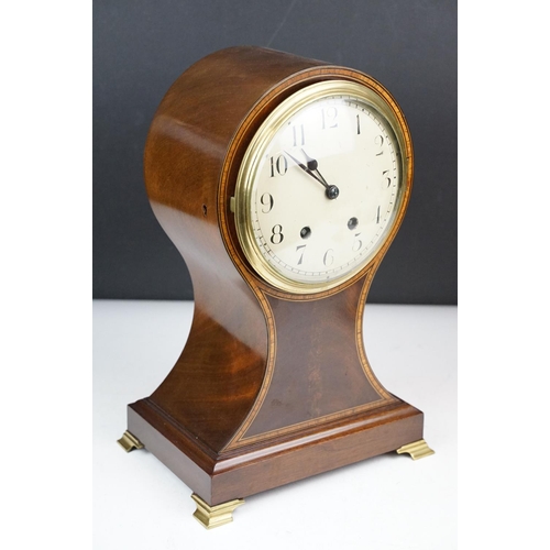 135 - Early 20th century inlaid mahogany balloon form mantel clock, raised on four gilt metal bracket feet... 