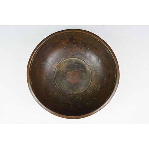 139 - Chinese bronze bowl of circular form, with a band of repeating decoration in relief, approx 24.5cm d... 