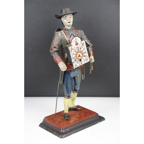 146 - Dutch painted cast metal novelty clock in the form of a clock peddler, approx 38cm high