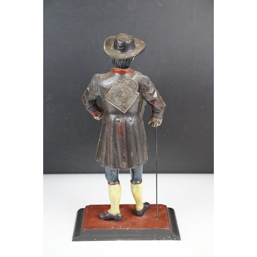 146 - Dutch painted cast metal novelty clock in the form of a clock peddler, approx 38cm high