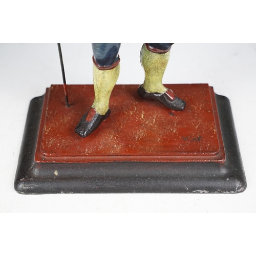 146 - Dutch painted cast metal novelty clock in the form of a clock peddler, approx 38cm high