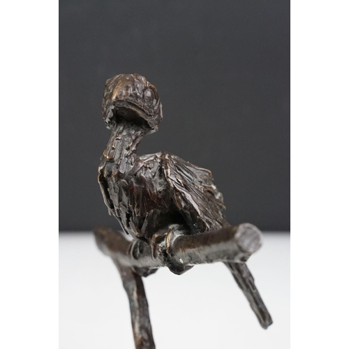 147 - Graham High - A bronze sculpture of a bird perched on a branch, raised on a rectangular base, signed... 