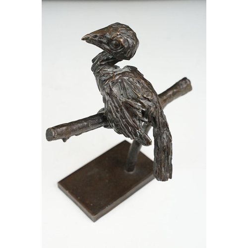 147 - Graham High - A bronze sculpture of a bird perched on a branch, raised on a rectangular base, signed... 