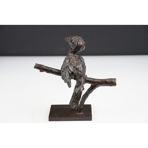 147 - Graham High - A bronze sculpture of a bird perched on a branch, raised on a rectangular base, signed... 