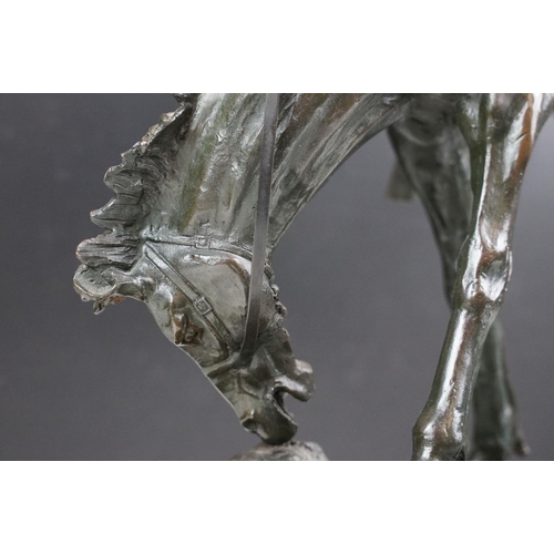 148 - Bronze figure of a rodeo rider on a marble base after Frederic Remington, height approx 48cm