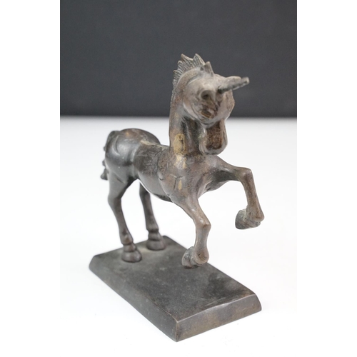 149 - Bronze figure of a leaping unicorn, together with a carved hardwood model of a rearing horse (approx... 