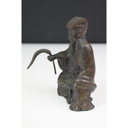 150 - Chinese bronze figure of an old man in traditional dress, approx 17cm tall