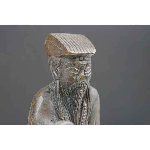 150 - Chinese bronze figure of an old man in traditional dress, approx 17cm tall