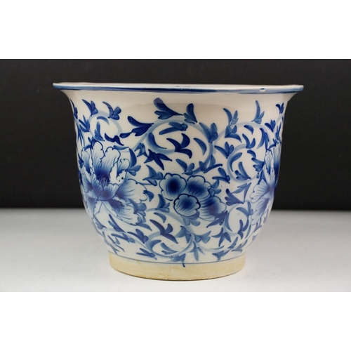 53 - Oriental blue & white ceramic planter with floral decoration, approx 21cm high