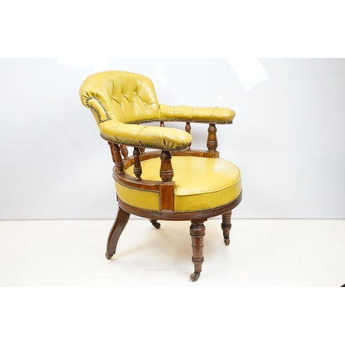 656 - Edwardian mahogany tub shaped armchair, with studded green leatherette button back above galleried b... 