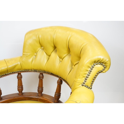 656 - Edwardian mahogany tub shaped armchair, with studded green leatherette button back above galleried b... 