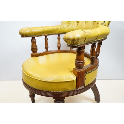 656 - Edwardian mahogany tub shaped armchair, with studded green leatherette button back above galleried b... 