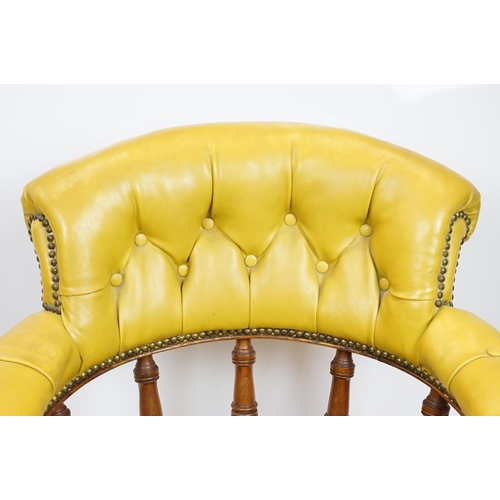 656 - Edwardian mahogany tub shaped armchair, with studded green leatherette button back above galleried b... 