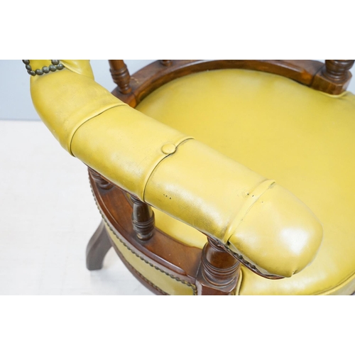 656 - Edwardian mahogany tub shaped armchair, with studded green leatherette button back above galleried b... 