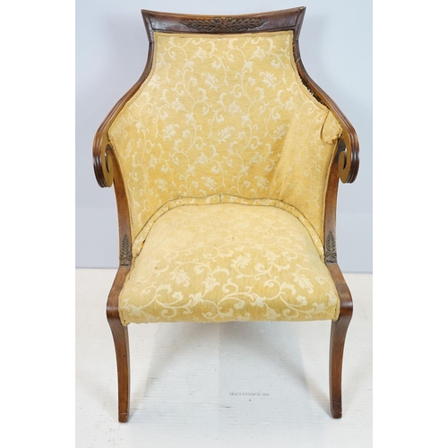 657 - Empire style mahogany chair, with carved top rail above scroll arms with carved motif on sabre legs,... 