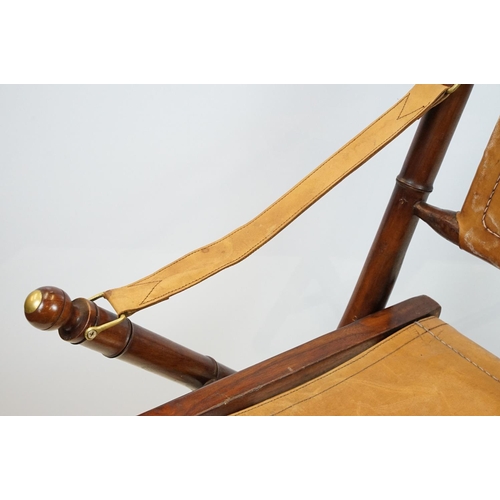 659 - 20th century mahogany campaign style chair, the frame carved to simulate bamboo with tan leather, se... 