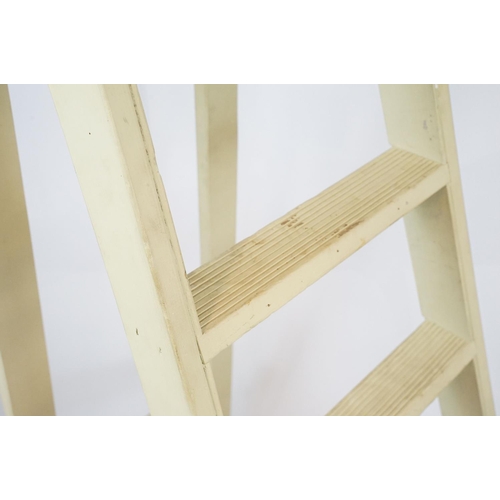 679 - Green painted decorative ladder with seven steps, 174cm high