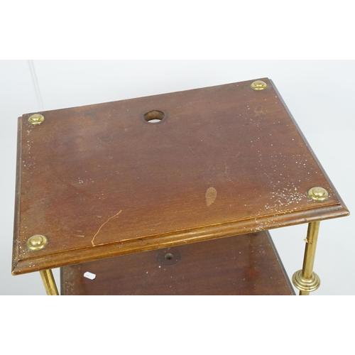 683 - Mahogany two tier table with brass supports and x-stretcher, 80cm high x 45cm wide x 36cm deep