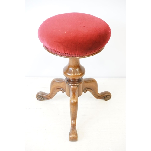 687 - Mahogany piano stool, with three scroll carved legs and velvet top, 50cm high