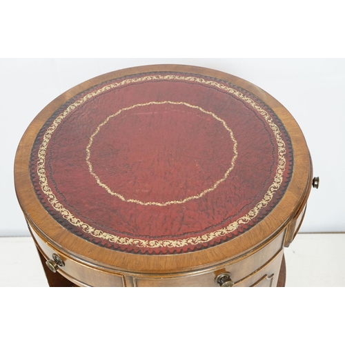 690 - Early 20th century mahogany revolving drum bookcase, with red leather gilt embossed top, with three ... 