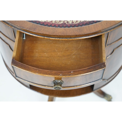 690 - Early 20th century mahogany revolving drum bookcase, with red leather gilt embossed top, with three ... 