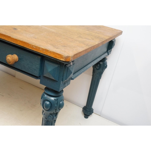 692 - Oak kitchen table with two drawers, the base painted in blue, on carved legs, 72cm high x 134cm wide... 