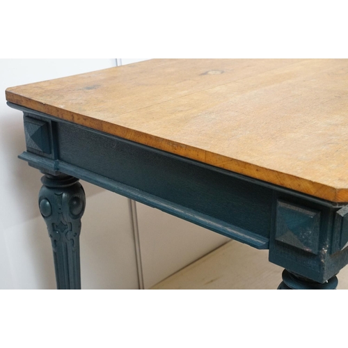 692 - Oak kitchen table with two drawers, the base painted in blue, on carved legs, 72cm high x 134cm wide... 