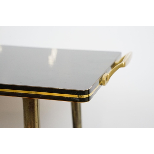 694 - Mid century black and gold two tier trolley table , 70cm high x 81cm wide x 40cm deep