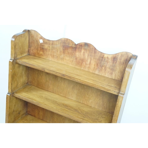 696 - Vintage waxed and polished four tier pine bookcase, 114cm high x 65cm wide x 31cm deep