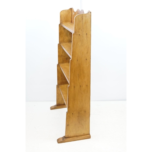 696 - Vintage waxed and polished four tier pine bookcase, 114cm high x 65cm wide x 31cm deep