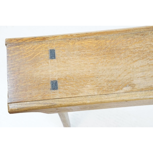 710 - Oak refectory style kitchen bench with stretchered base on tapering legs, 44cm high x 142cm wide x 2... 