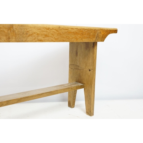 710 - Oak refectory style kitchen bench with stretchered base on tapering legs, 44cm high x 142cm wide x 2... 