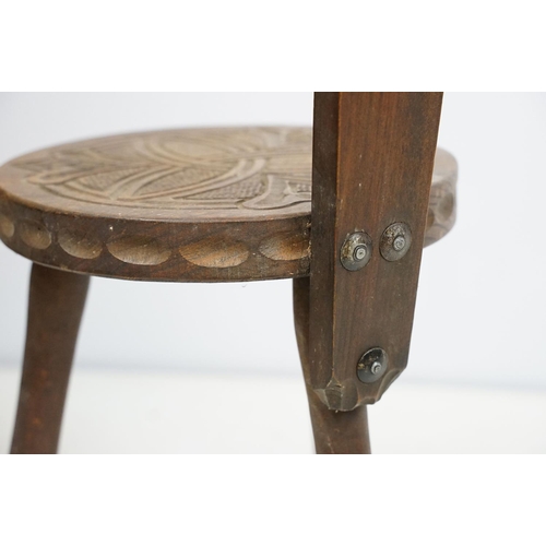 711 - Mid century Ben Setter of Totnes three legged spinning chair with Celtic design, stamped verso, 86cm... 