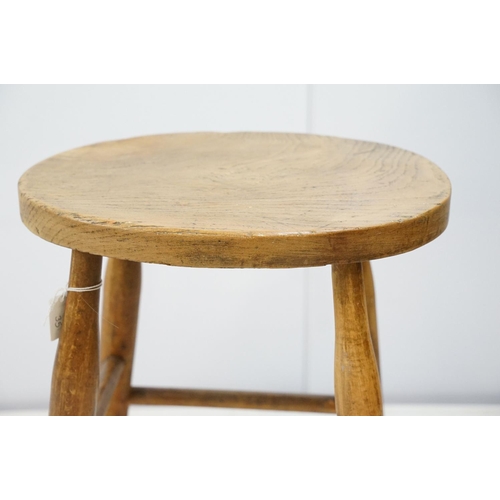 721 - 19th century stool with oval one piece elm seat, 44cm high x 31cm wide