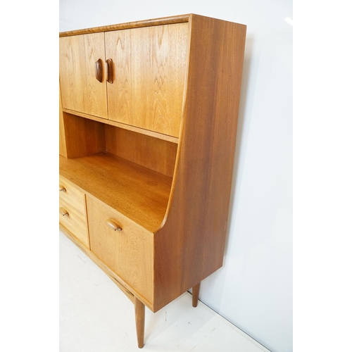 745 - G Plan teak sideboard, with cupboards above two long drawers and a further cupboard, with maker's la... 