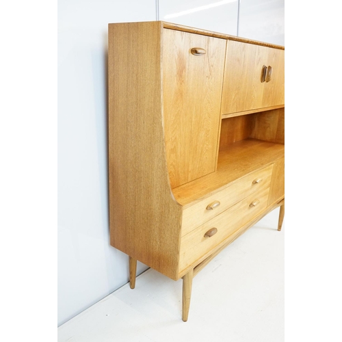 745 - G Plan teak sideboard, with cupboards above two long drawers and a further cupboard, with maker's la... 