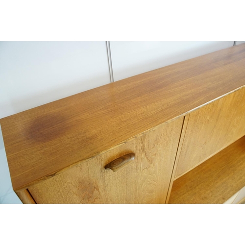 745 - G Plan teak sideboard, with cupboards above two long drawers and a further cupboard, with maker's la... 