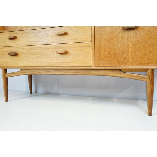 745 - G Plan teak sideboard, with cupboards above two long drawers and a further cupboard, with maker's la... 