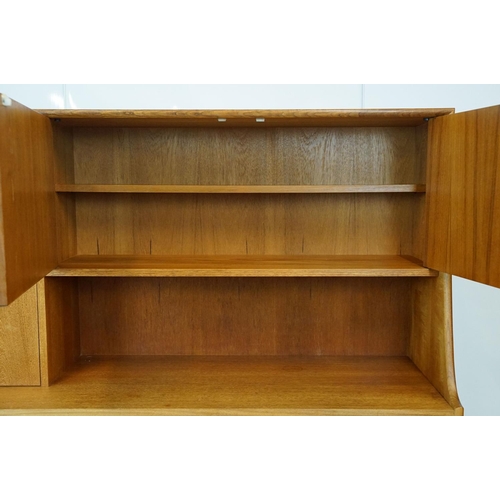 745 - G Plan teak sideboard, with cupboards above two long drawers and a further cupboard, with maker's la... 